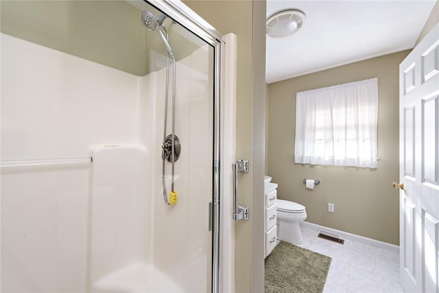 bathroom with vanity, toilet, tile patterned floors, and walk in shower