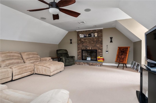 carpeted living room featuring vaulted ceiling, ceiling fan, and a fireplace