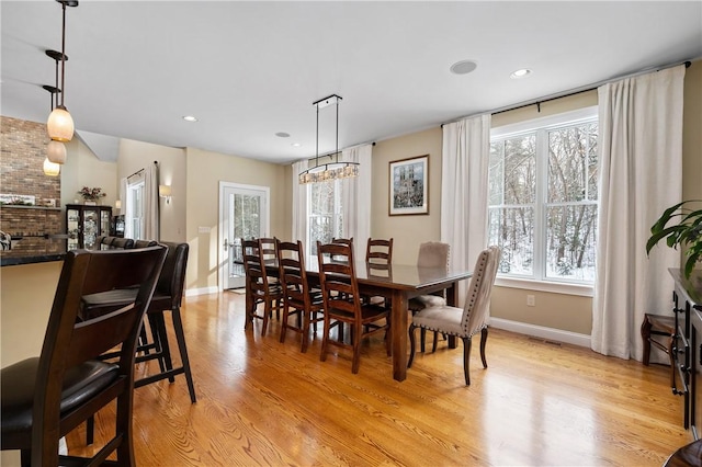 dining room with light wood-type flooring