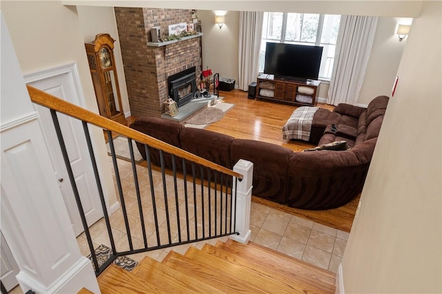 living room featuring tile patterned flooring and a fireplace