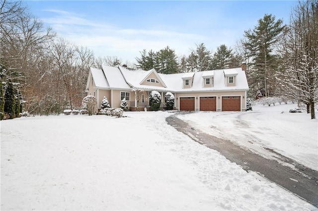 cape cod-style house with a garage