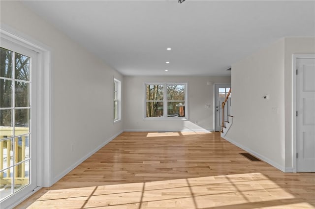 interior space featuring plenty of natural light and light hardwood / wood-style floors