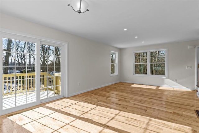 unfurnished room with light hardwood / wood-style floors