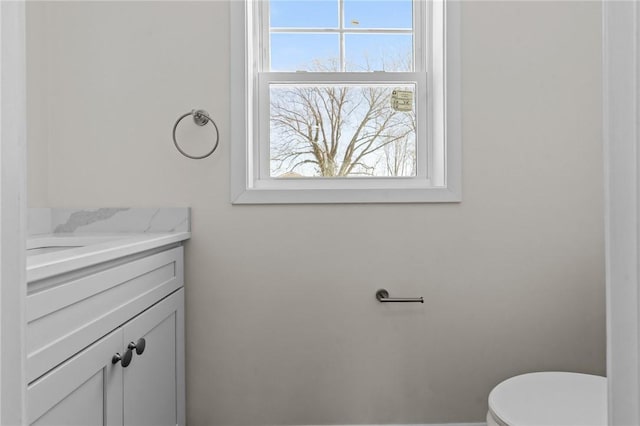 bathroom with vanity and toilet