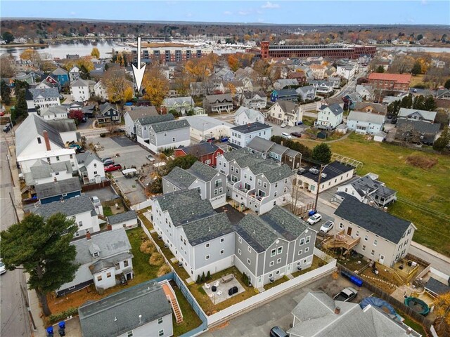 birds eye view of property featuring a water view and a residential view