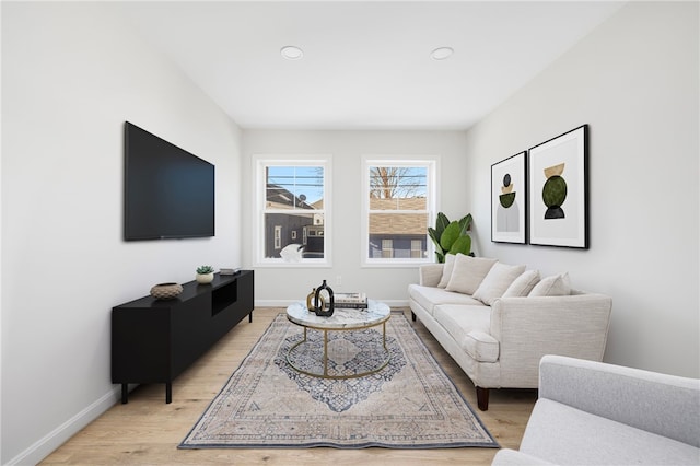 living room with light wood-style floors and baseboards