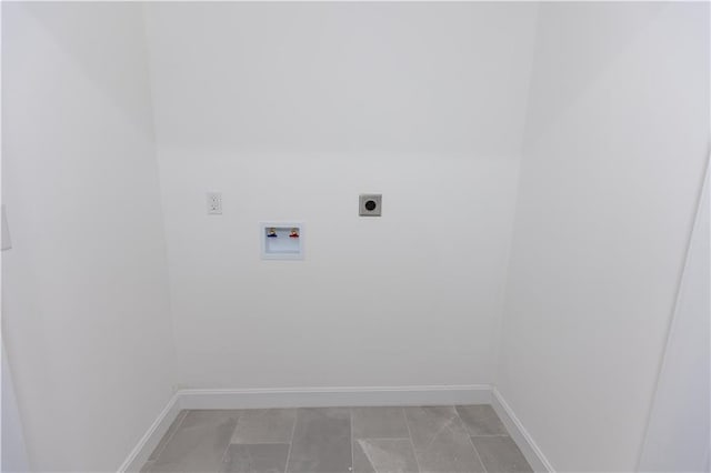 laundry area with washer hookup, hookup for an electric dryer, and light tile patterned floors