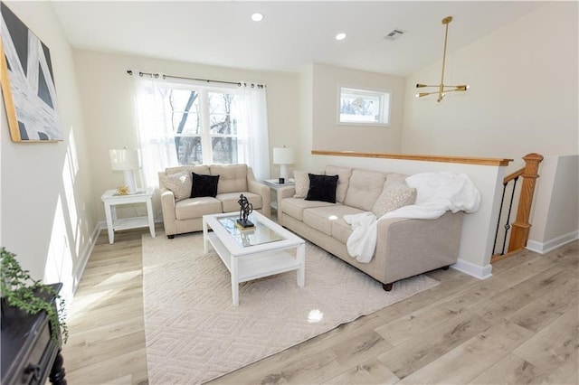 living room featuring light hardwood / wood-style flooring and a healthy amount of sunlight