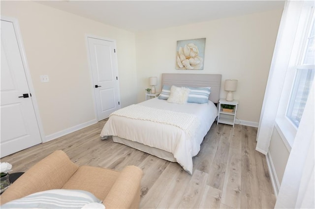 bedroom with light hardwood / wood-style flooring