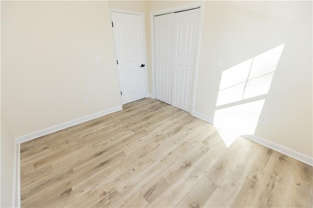 empty room with light wood-type flooring