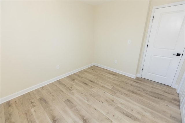 unfurnished room with light wood-type flooring