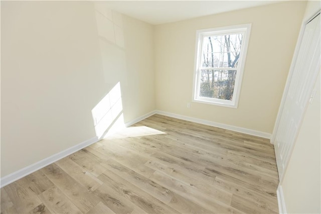 unfurnished room featuring light hardwood / wood-style floors