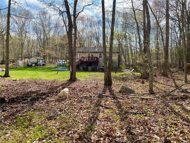 view of yard featuring a wooden deck