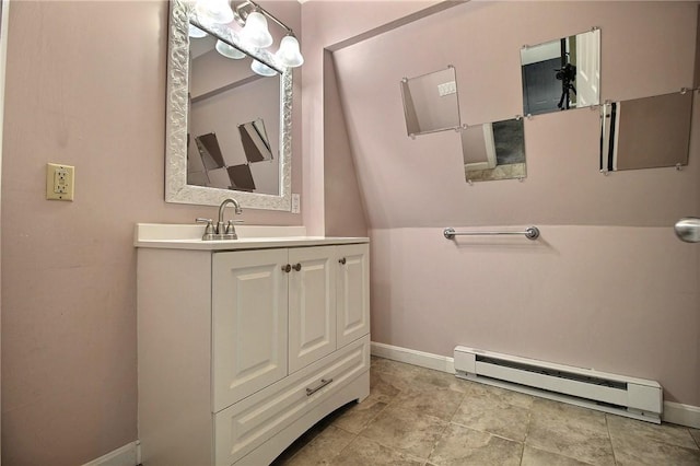 bathroom with vanity and baseboard heating