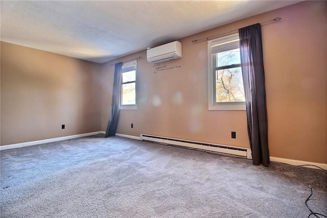 carpeted spare room featuring plenty of natural light, a baseboard heating unit, a wall mounted air conditioner, and a textured ceiling