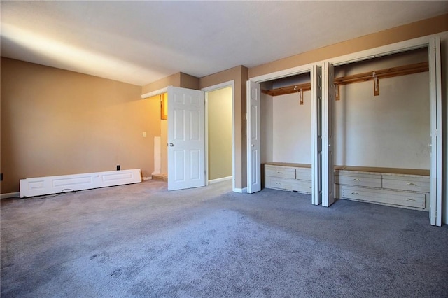 unfurnished bedroom with dark carpet