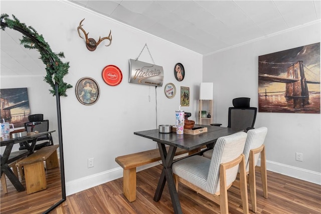 dining room featuring crown molding and wood-type flooring