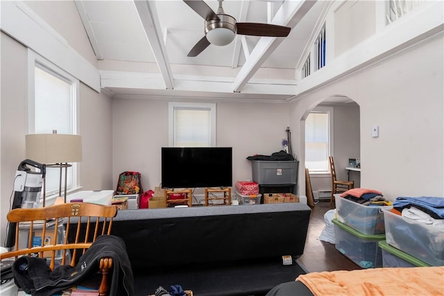 living room with lofted ceiling with beams and ceiling fan