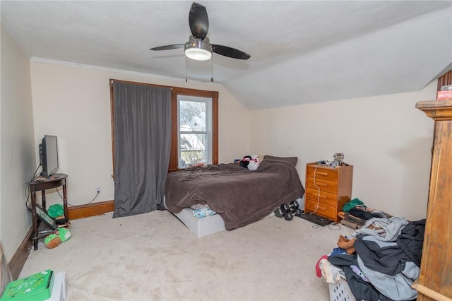 bedroom featuring vaulted ceiling, light carpet, and ceiling fan