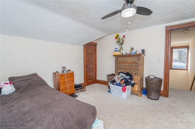 bedroom featuring vaulted ceiling, carpet floors, and ceiling fan