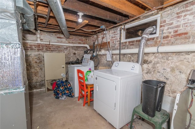 washroom with washing machine and clothes dryer