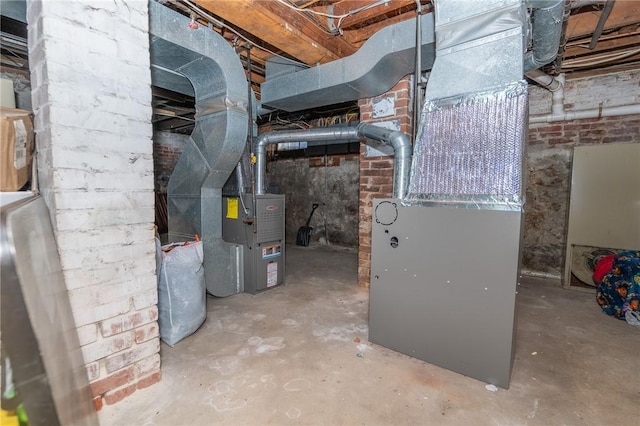 utility room featuring heating unit