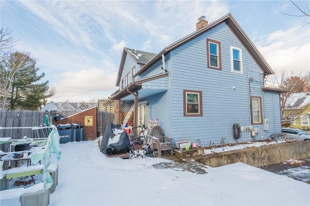 view of snow covered house