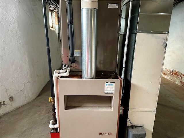 utility room featuring heating unit