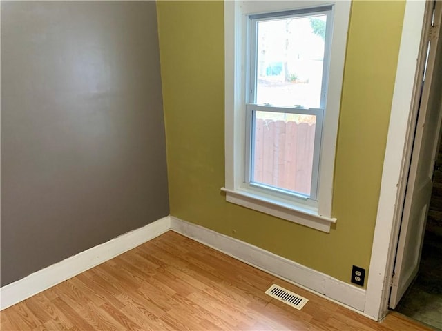 empty room with light wood-type flooring