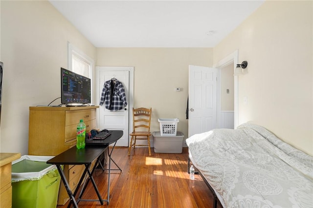 bedroom with wood-type flooring