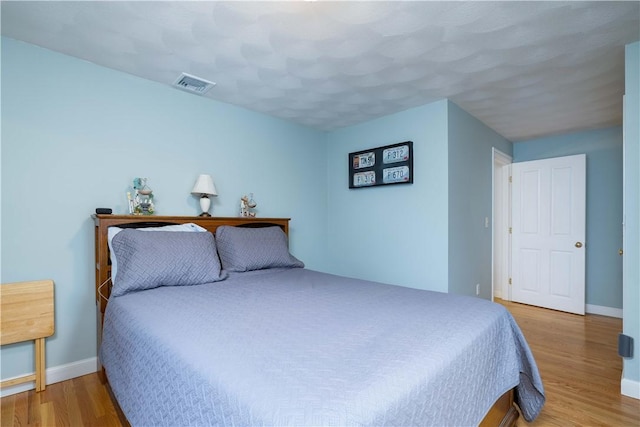 bedroom featuring hardwood / wood-style flooring