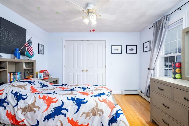 bedroom featuring light hardwood / wood-style flooring, a closet, and ceiling fan