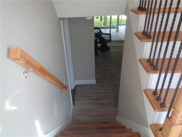 stairs with hardwood / wood-style floors