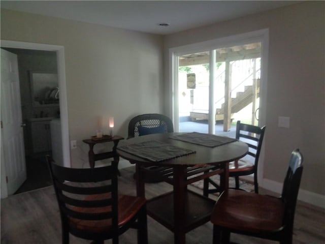 dining area with hardwood / wood-style flooring