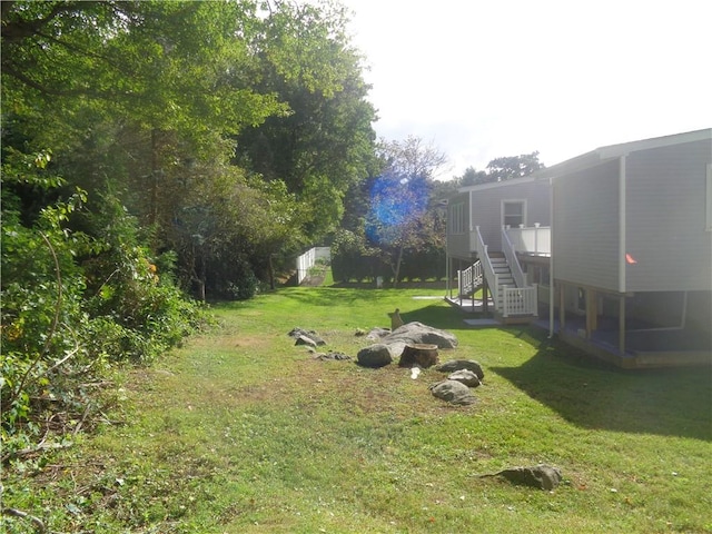 view of yard with a wooden deck