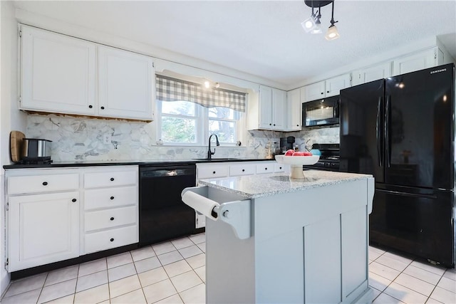 kitchen with sink, tasteful backsplash, black appliances, white cabinets, and a kitchen island