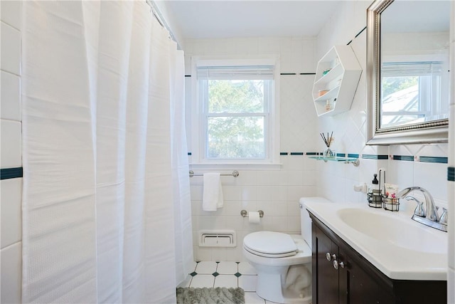 bathroom featuring tile walls, decorative backsplash, tile patterned flooring, vanity, and toilet