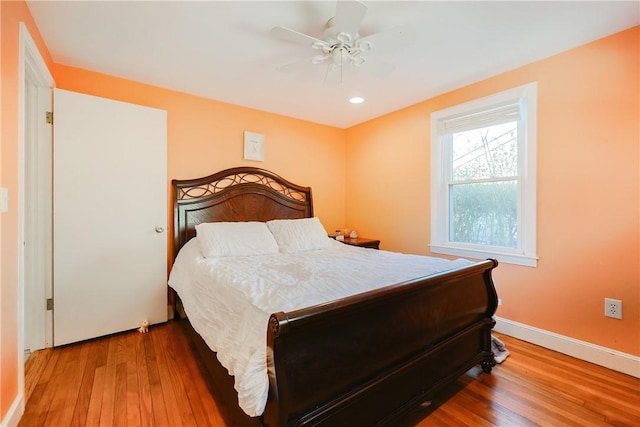 bedroom featuring wood-type flooring and ceiling fan