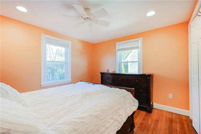 bedroom featuring light hardwood / wood-style flooring and ceiling fan