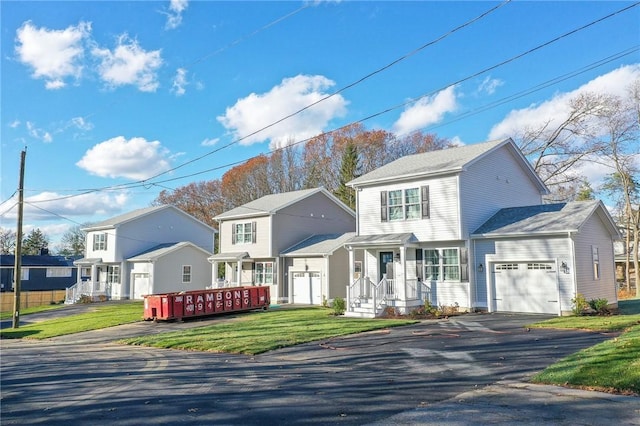 view of front facade with a garage and a front lawn