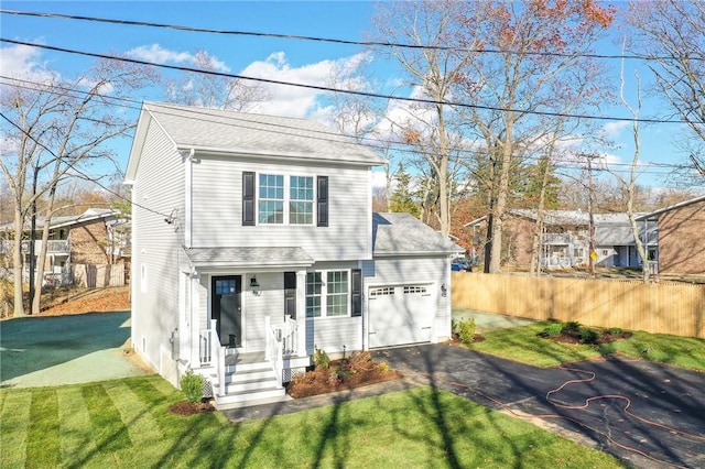 back of property featuring a garage and a yard