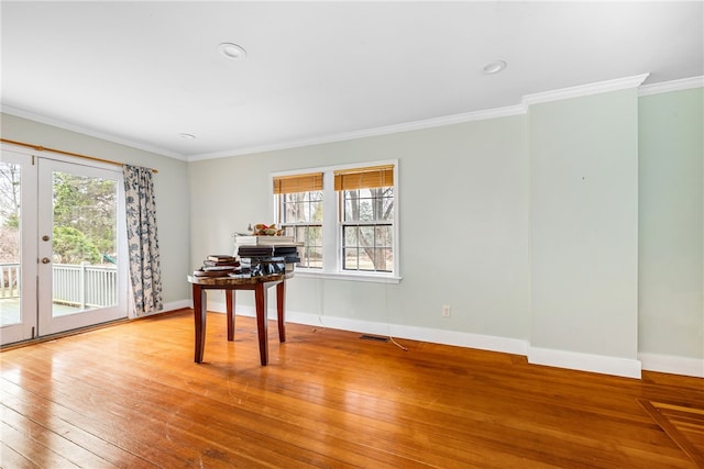 office featuring baseboards, visible vents, hardwood / wood-style flooring, ornamental molding, and recessed lighting