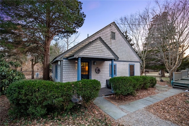 bungalow-style home featuring fence