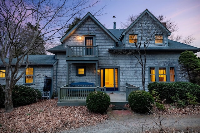 shingle-style home with a balcony