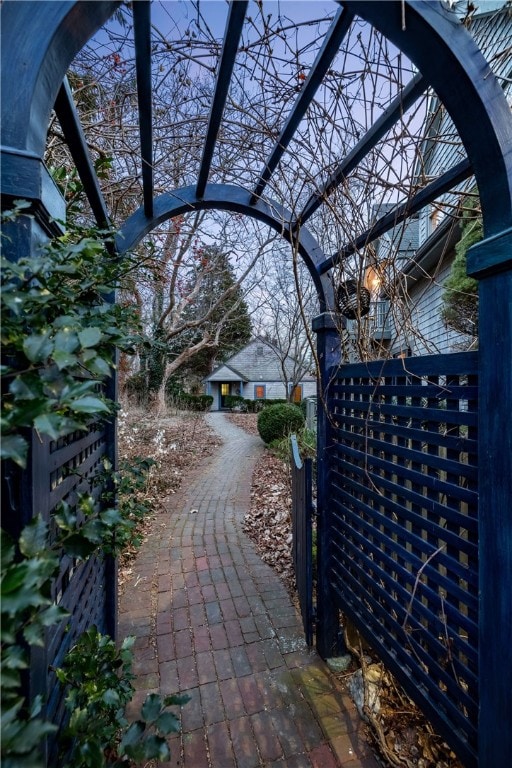 exterior space with driveway and a gated entry