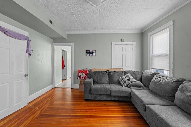 living room with hardwood / wood-style flooring and ornamental molding