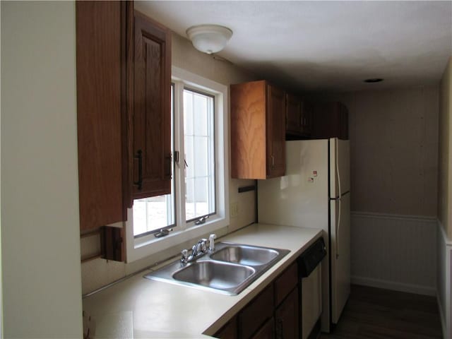 kitchen with sink and stainless steel dishwasher