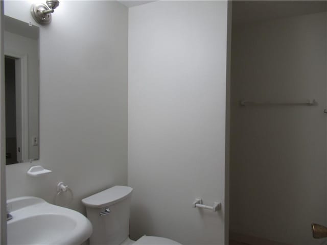 bathroom with sink and toilet