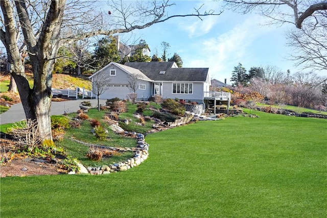 view of front facade with a garage and a front yard