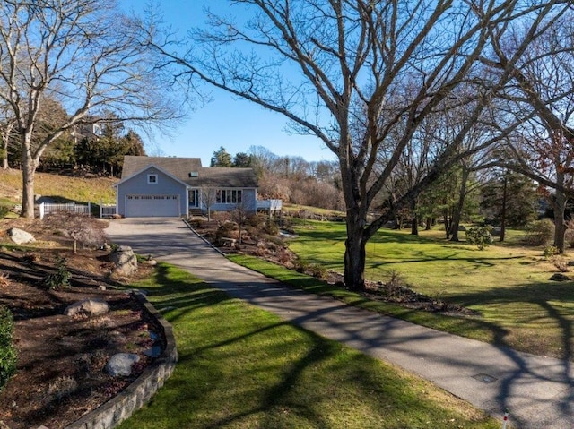 view of front facade featuring a garage and a front yard